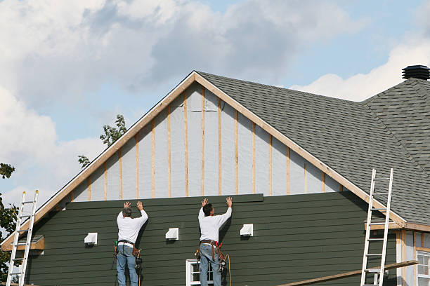 Professional Siding technician working in Scottsville, NY